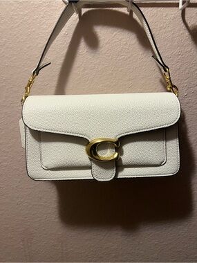 White tabby coach bag